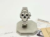 a watch sitting on top of a piece of paper on a table