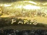 a close up of a gold ring with a horse on it