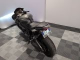 a motorcycle that is parked on a checkered floor