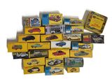 a pile of toy cars that are sitting on top of each other