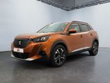 a orange suv parked in a large room with a white wall
