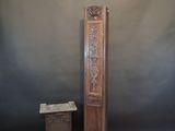 a tall wooden clock sitting next to a small wooden box