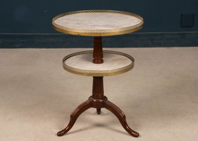a three tiered table with a marble top