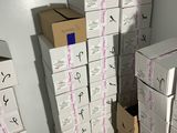 many boxes stacked on top of each other in a room