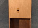 an image of a wooden cabinet on a gray background
