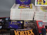 a lot of comic books on the table together