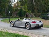 a silver sports car driving down the road