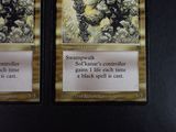 two cards that are sitting on a table