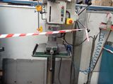 a machine that is sitting in a room with a red and white tape around it