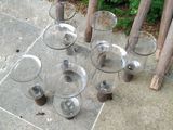 a group of glass vases sitting on the ground