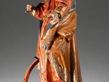 an image of a statue of a man in a red robe