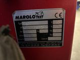 a close up of a label on a red fire hydrant