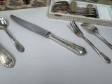 silverware on a table with a box of silverware