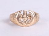 an image of a gold ring with a dragon on it