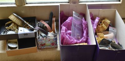 two boxes with different items in them on a table
