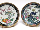 pair of chinese porcelain plates with birds and flowers on them
