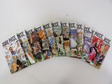 seven books of one piece comics on a white surface