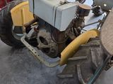 a tractor that is parked inside of a garage