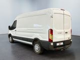 a white van that is parked in a room