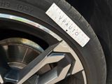 a close up of a tire with a sticker on it