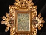 a picture of a gold frame with a picture of jesus on it