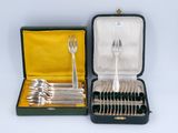 a case with silverware in it on a white surface