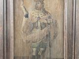 an old picture of a man holding a sword in a wooden frame