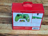a box with a game controller on it on a wooden table