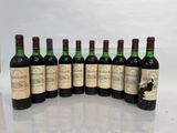 six bottles of wine lined up in a row on a table
