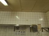 a picture of a kitchen with a sink and a stove