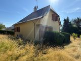 an image of a house in the middle of a field