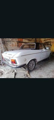 a white car that is parked in a garage