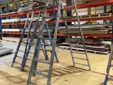 many ladders that are sitting in a warehouse