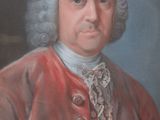 portrait of a man in a red coat and white hair