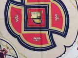 an image of a scarf with a crest on it