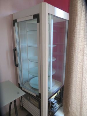 a glass case with a plate inside of it