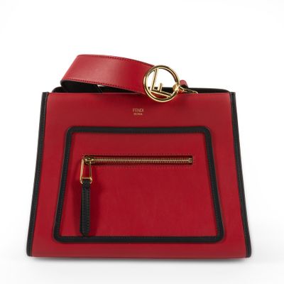 a red and black handbag on a white background