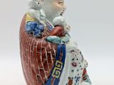an image of a figurine of a man sitting on top of a table