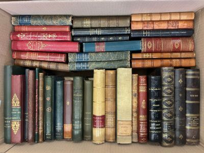 a box full of old books sitting on a table