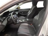the interior of a white car with black leather seats and a steering wheel