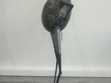 a statue of a bird with a crown on it ' s head