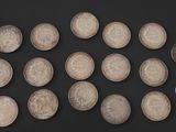 a lot of coins that are on a black surface