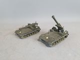 two toy tanks that are sitting on a white surface