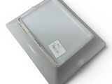 a small square light that is on top of a table