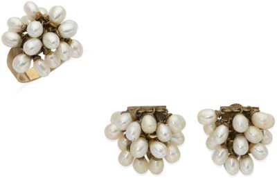 three pairs of pearl earrings and a ring on a white background