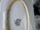 a white plate with a blue and white design on it