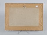 an old picture frame with a piece of cardboard on top of it