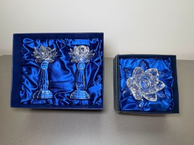 pair of crystal candlesticks in a blue box on a table