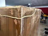 a large piece of luggage sitting in the middle of a room
