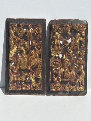 these are two pieces of art that are on a white surface
